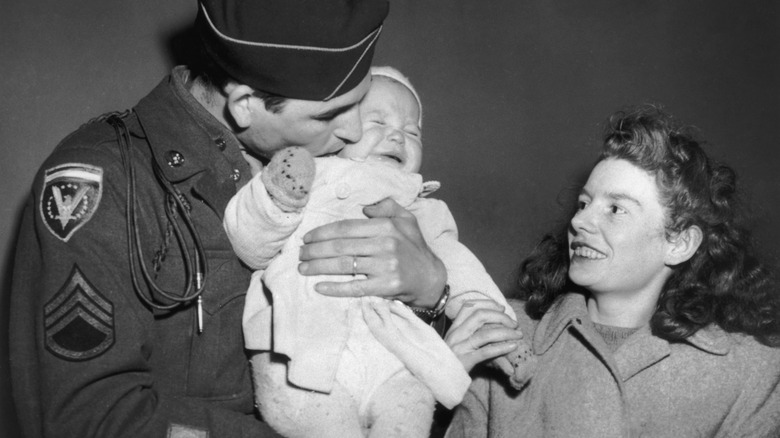 Father greeting his child just after WWII