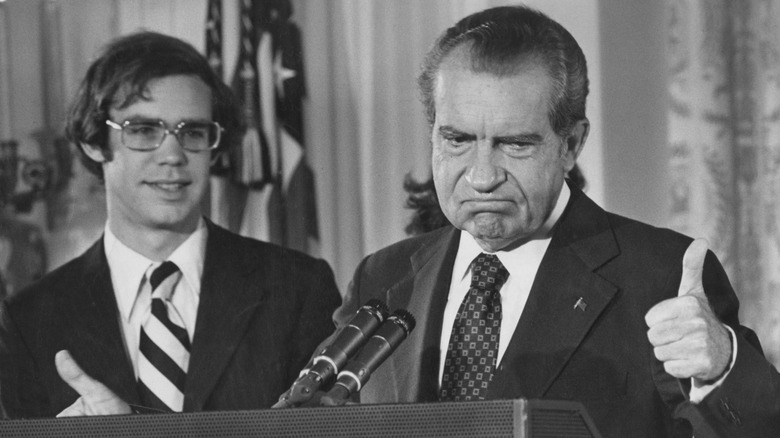 Richard Nixon gives the thumbs up