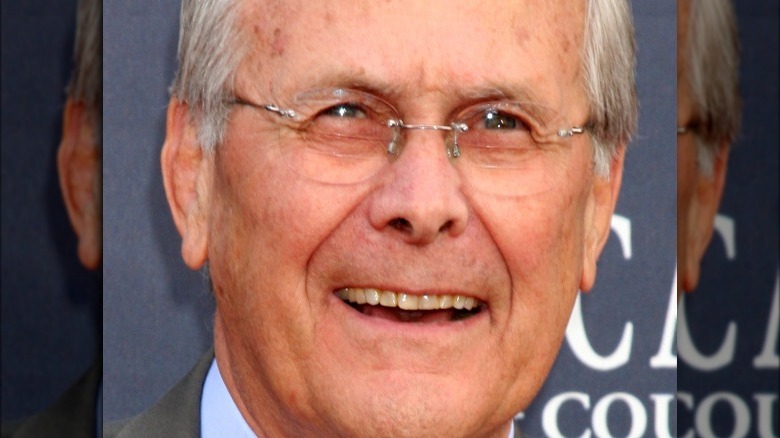 Donald Rumsfeld smiles at the camera