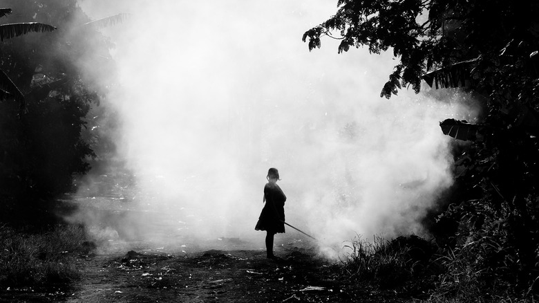 woman's shadow against smoke