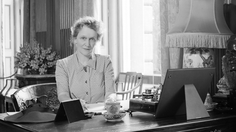 Nancy Astor sitting at her desk