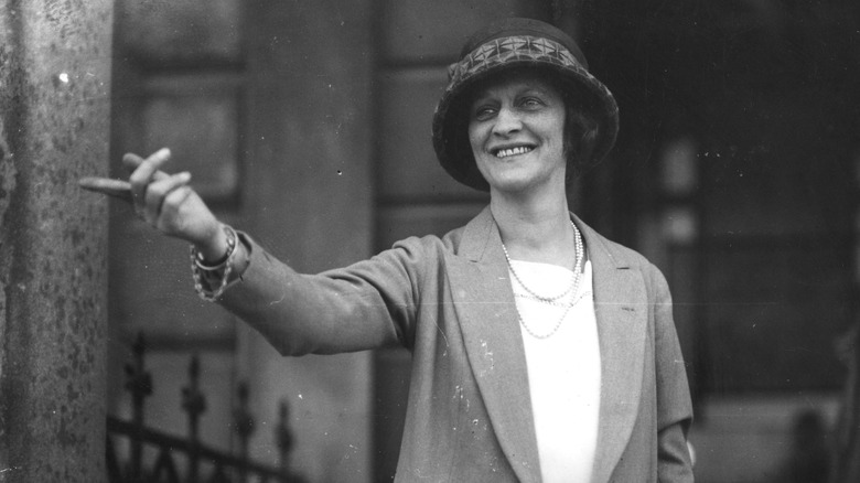 Nancy Astor pointing in the street