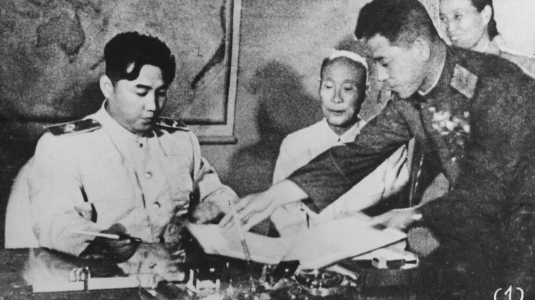 North Korea's Kim Il Sung signing armistice
