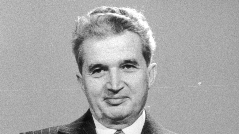 Nicolae Ceausescu at a podium 