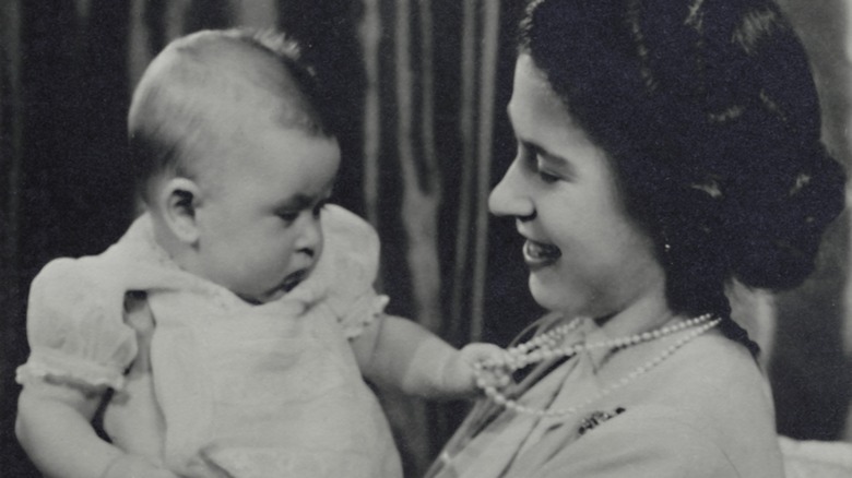 Princess Elizabeth smiling at Prince Charles