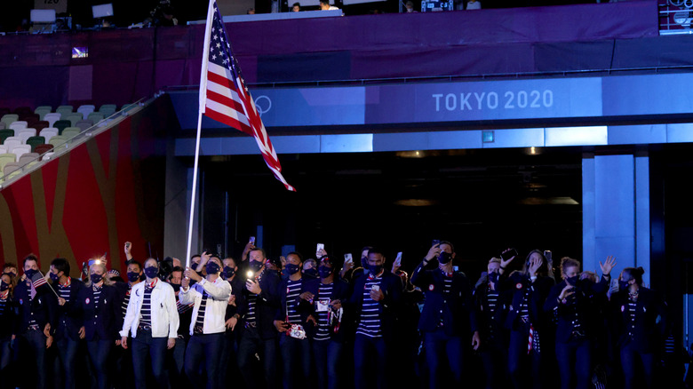 Eddy holds US flag