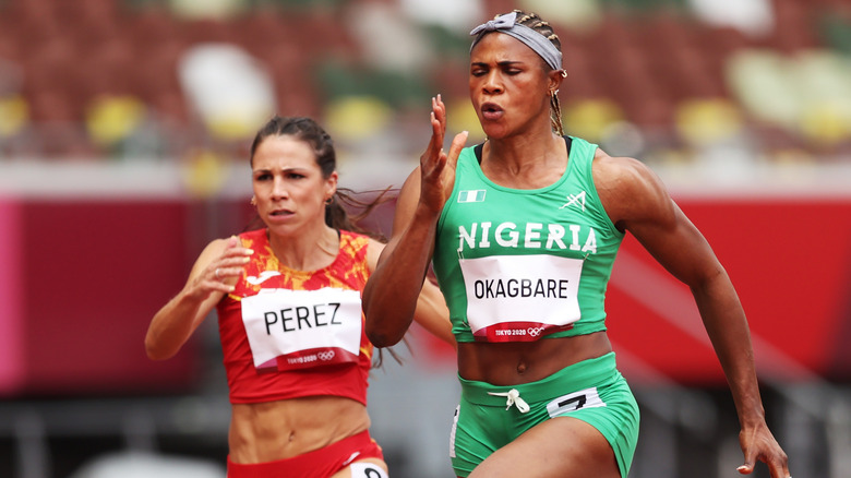 Blessing Okagbare running in the women's 100m heats at the Tokyo Olympics