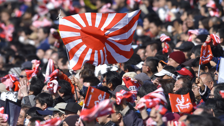 Fans with rising sun flag