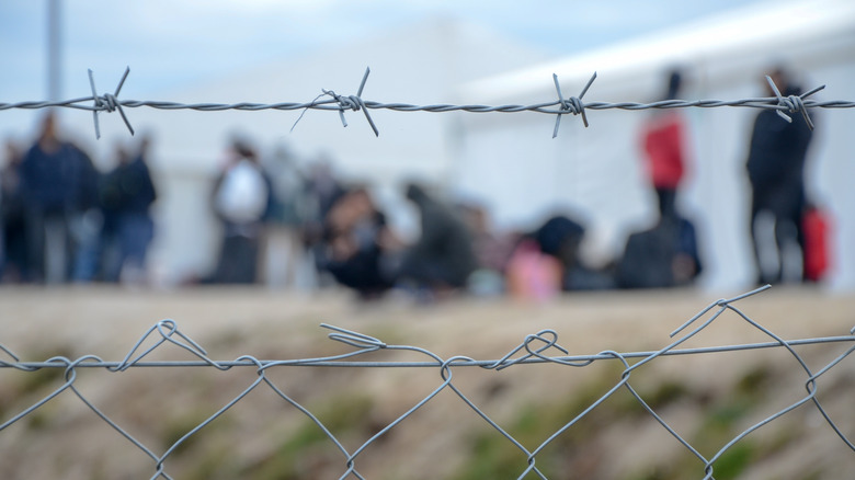 barbed wire fence at refugee camp