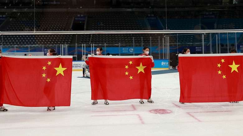Flag bearers holding Chinese flags at Winter Olympic opening