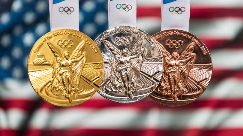 Medals hang in front of U.S. flag