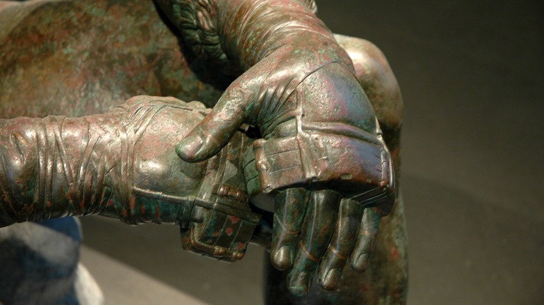 hands of a statue of a greek boxer