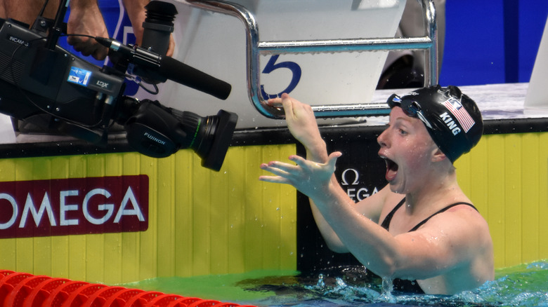Lilly King gesturing into camera
