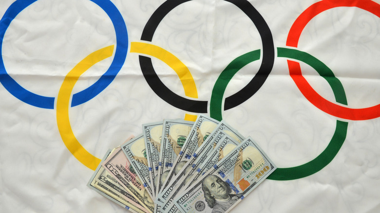 Money on an Olympic flag
