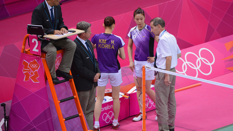 Official talks to badminton players