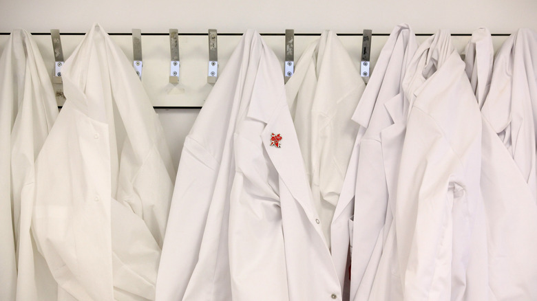 Lab coats on hooks