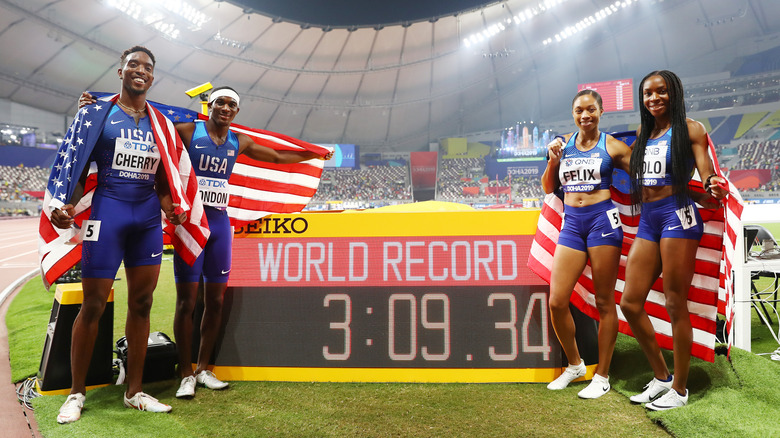 Allyson Felix posing with team