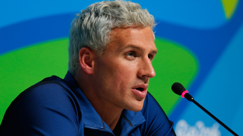 Ryan Lochte talks to reporters