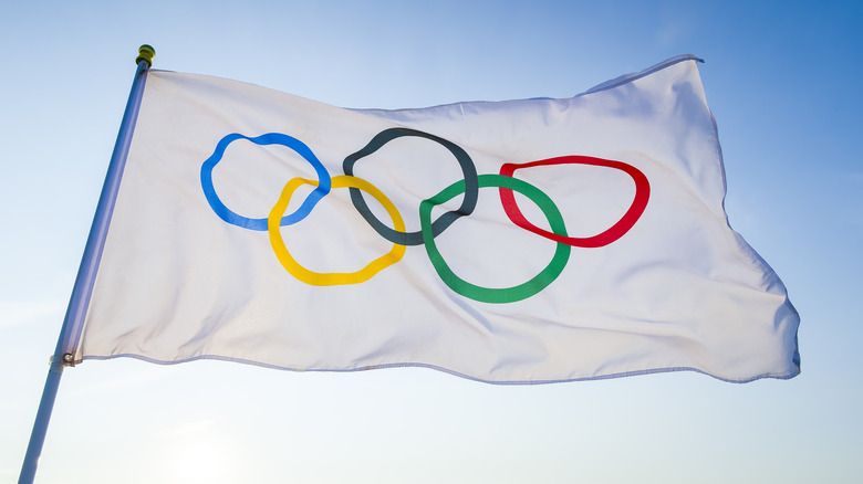 Olympic flag flying in breeze 