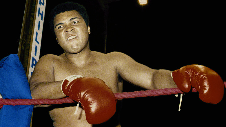 Muhammad Ali leaning on ropes