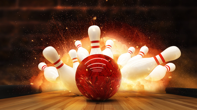 Bowling ball impacting pins