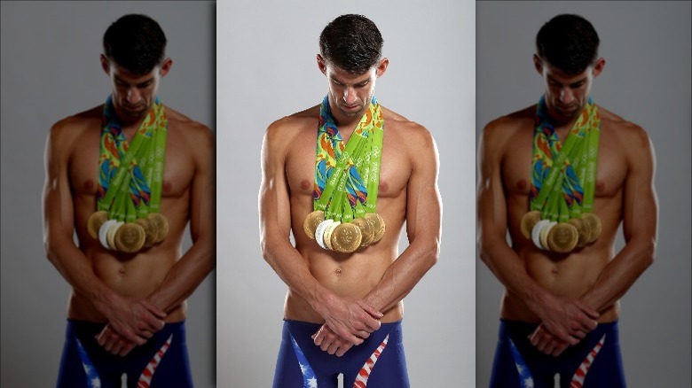 Michael Phelps wearing his gold medals