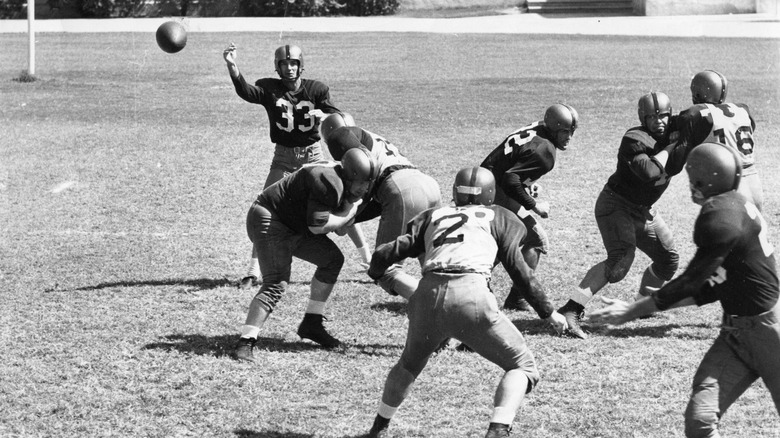 Sammy Baugh throws forward pass