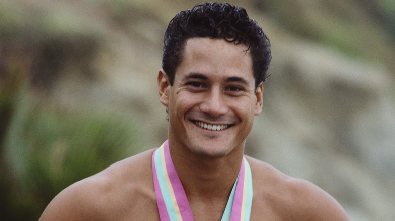 Greg Louganis smiling with medal
