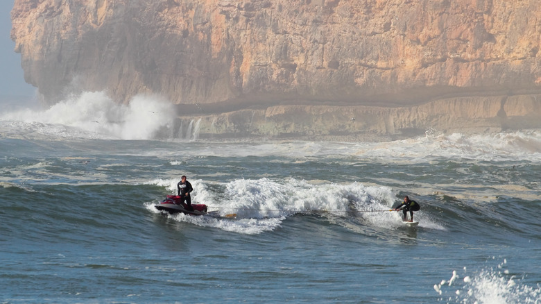 Garrett McNamara being towed 