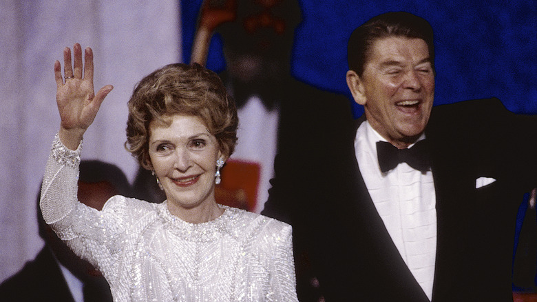 Nancy waving next to Ronald Reagan at an event
