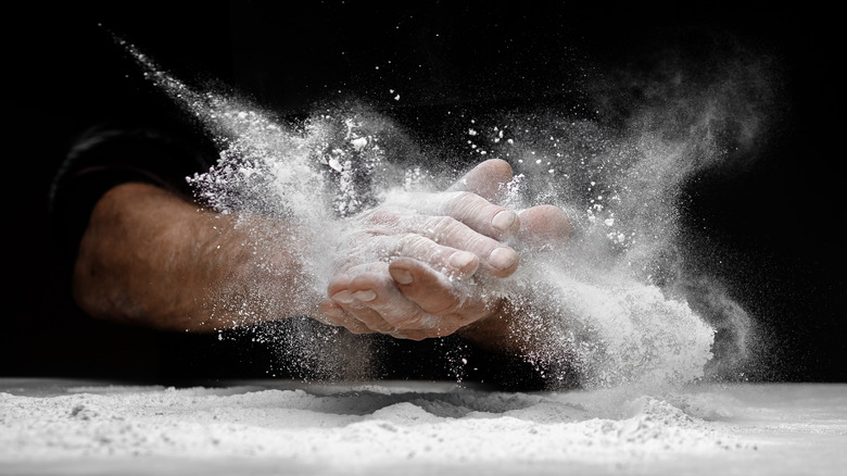 hands with flour