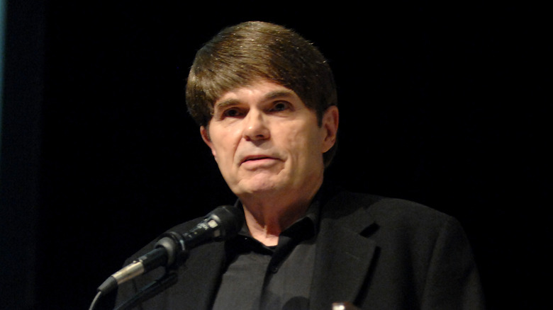 Dean Koontz behind a podium