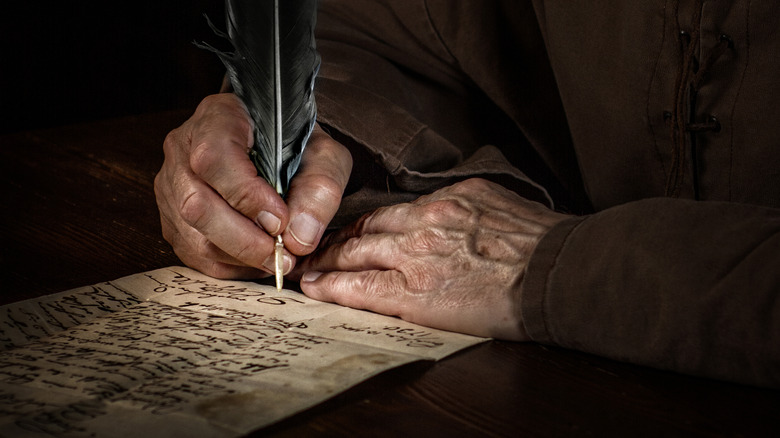 Medieval monk writing letter