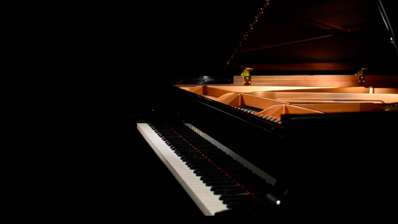 piano against a shadowy background