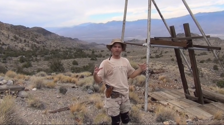 Kenny Veach next to the abandoned mine shaft