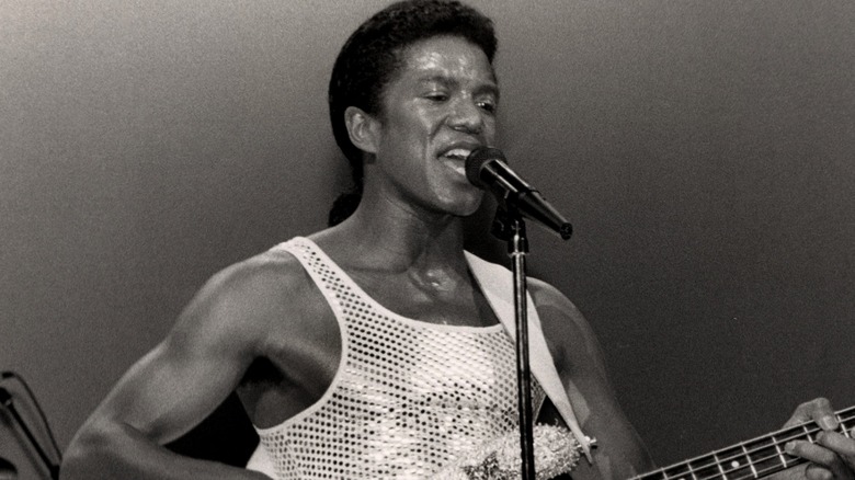 Jermaine Jackson playing guitar