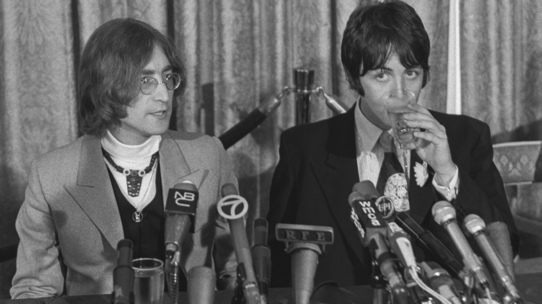 Lennon and McCartney talk to reporters