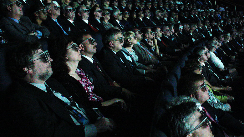 Cinema audience wearing 3D glasses