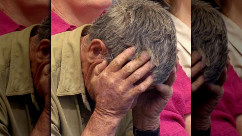 Bob Irwin with head in hands