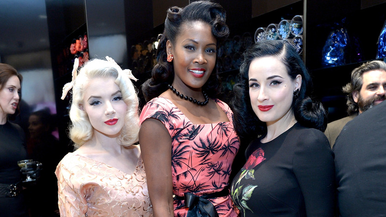 Burlesque dancers Mosh, Angelique Noire, and Dita von Teese