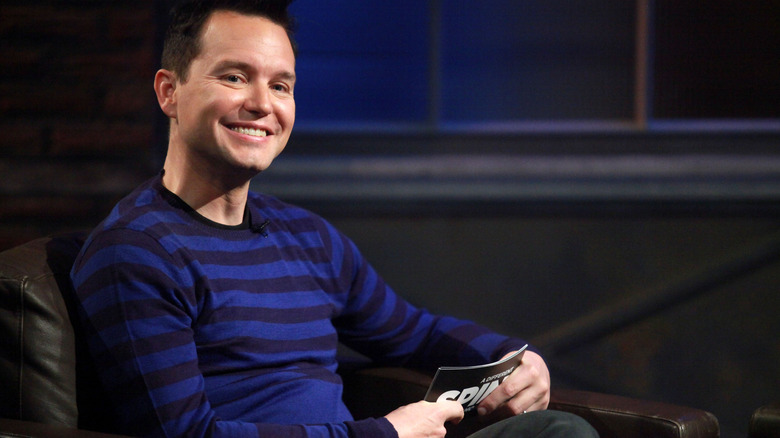 Mark Hoppus smiling striped shirt hosting his talk show