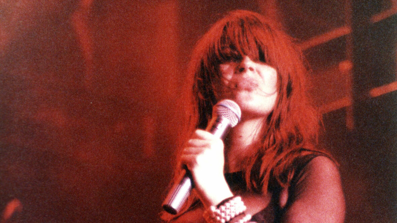 Chrissy Amphlett singing into mic