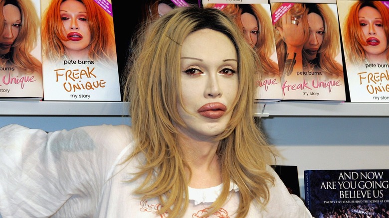 Pete Burns surrounded by his autobiography