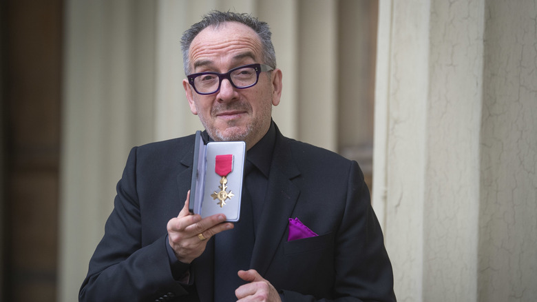 Elvis Costello receiving his OBE in 2019