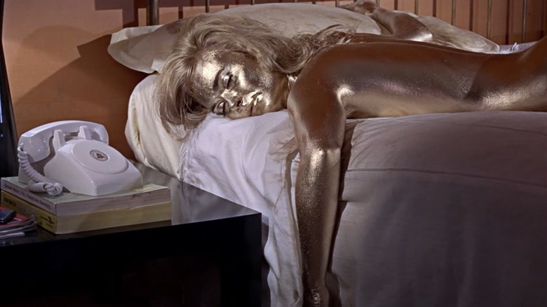 Screenshot from Goldfinger gold woman on bed