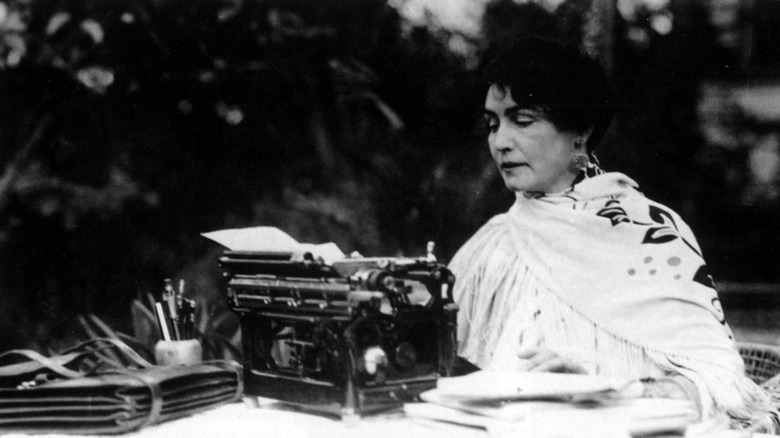 Lois Weber at a typewriter