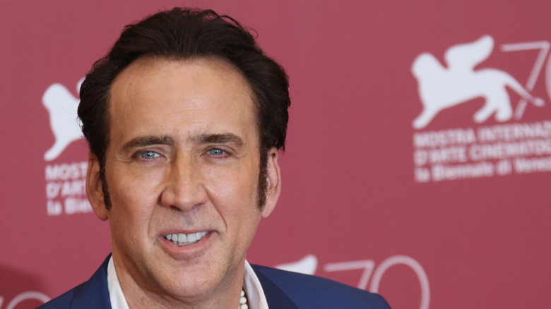 Nicolas Cage smiling blue suit