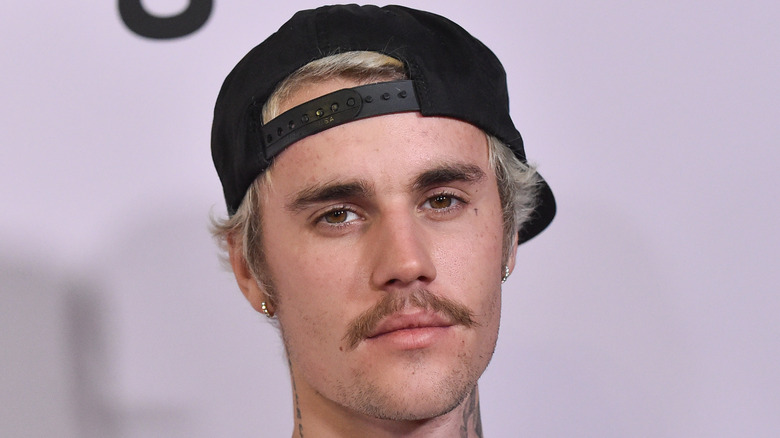 Justin Bieber baseball cap mustache
