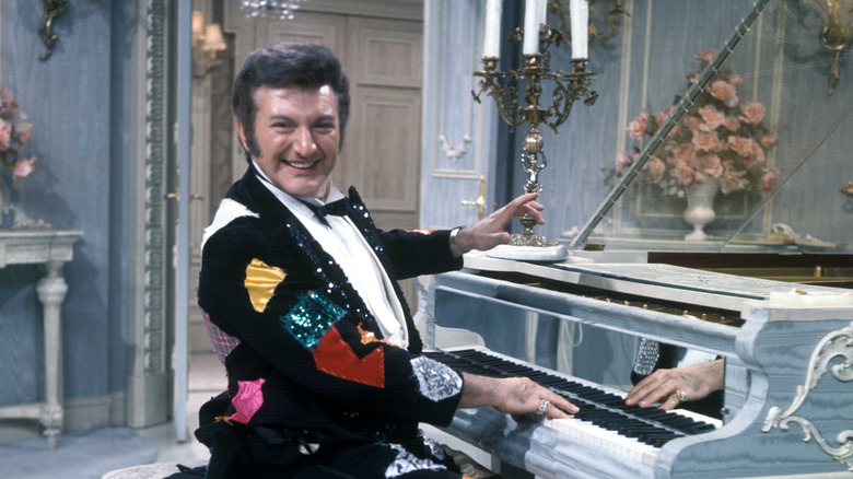 Liberace at a piano, 1969