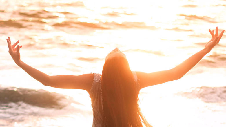 woman with arms in the air